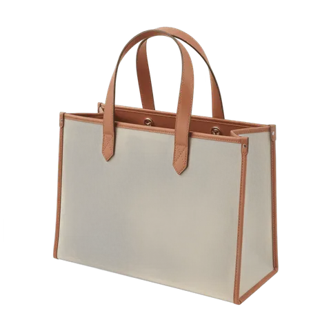 Elegant beige tote bag with brown leather handles isolated graphic for fashion branding and ecommerce PNG